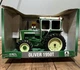 ERTL AGCO Oliver 1950T Tractor w/Hiniker 1300 cab green/white 1/16 scale NIB
