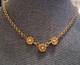 Flower trio pendant matte gold tone necklace w/faux pearls.  Signed EH. 16", 